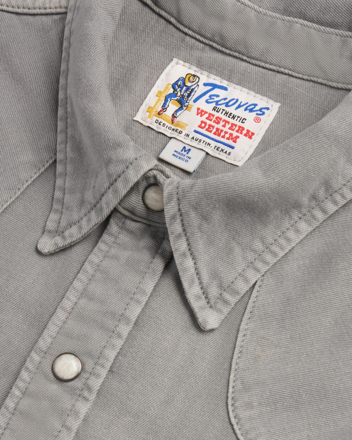Closeup detail view of Men's Denim Pearl Snap - Light Gray