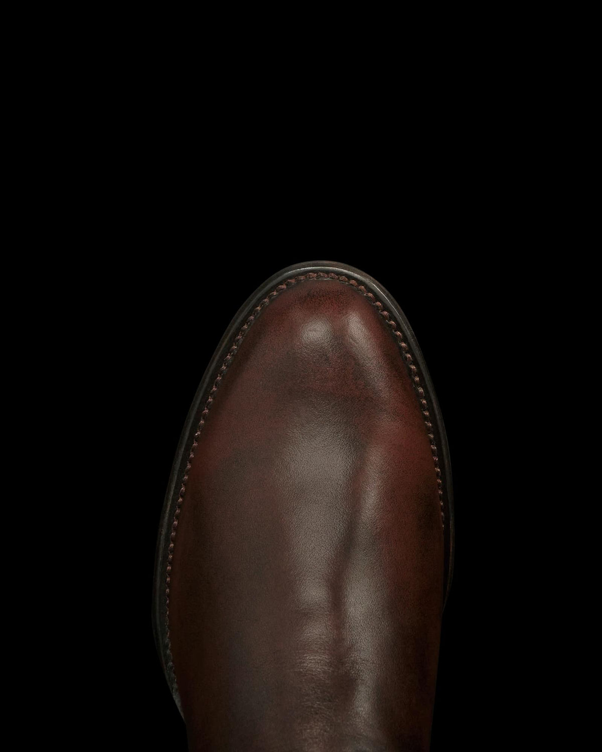 Toe view of The Dean - Iced Tea Cowhide on plain background