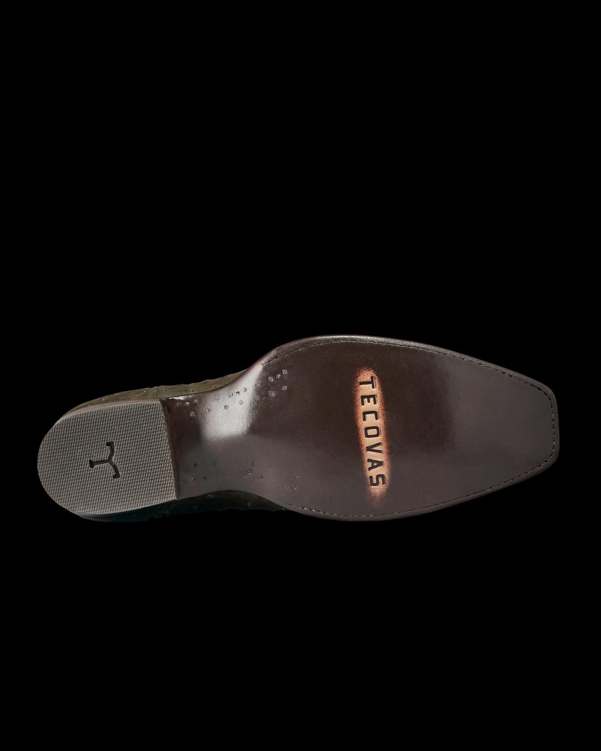 The Jack in Dark Forest Ostrich. The image shows the bottom view of a polished leather cowboy boot sole—crafted from premium Dark Forest Ostrich—with "TECOVIDAS" embossed near the heel and a textured rubber heel cap.