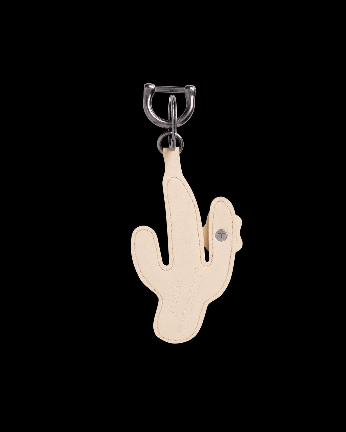 Beige leather keychain in the shape of a cactus with metal hardware, displayed on a white background.