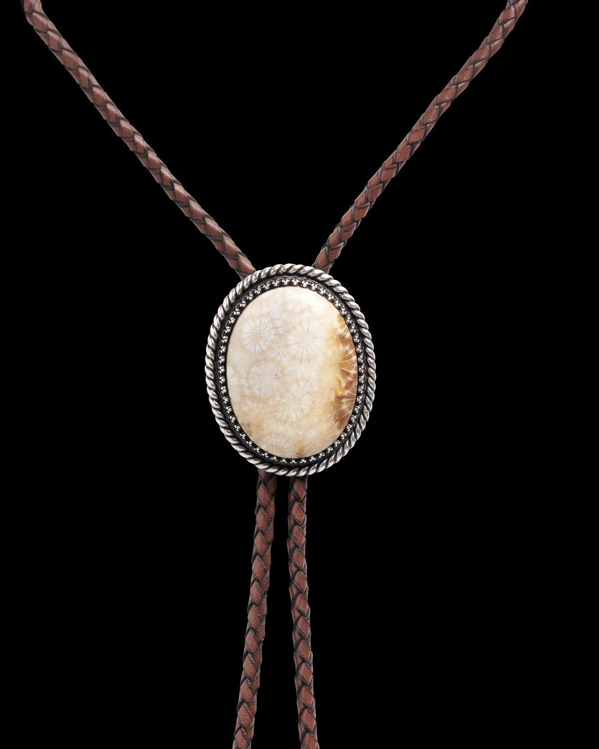 Closeup detail view of Iron Lamb Fossilized Coral Bolo - Cream / Black