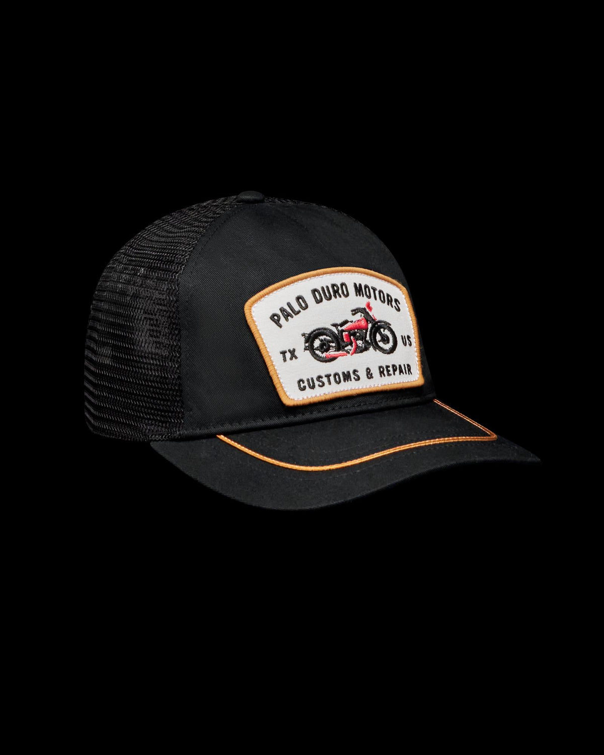 Quarterfront view of Palo Duro Motors 5 Panel Low Pro Trucker - Black on plain background