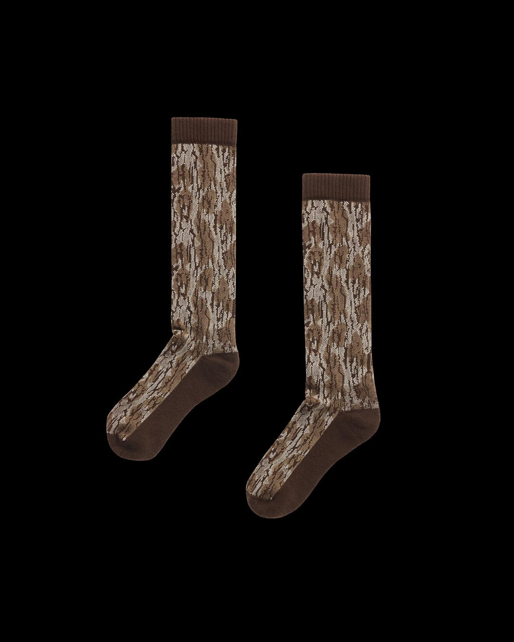 A pair of brown crew socks with a tree bark camouflage pattern, displayed on a plain white background.