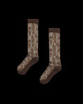A pair of brown crew socks with a tree bark camouflage pattern, displayed on a plain white background.