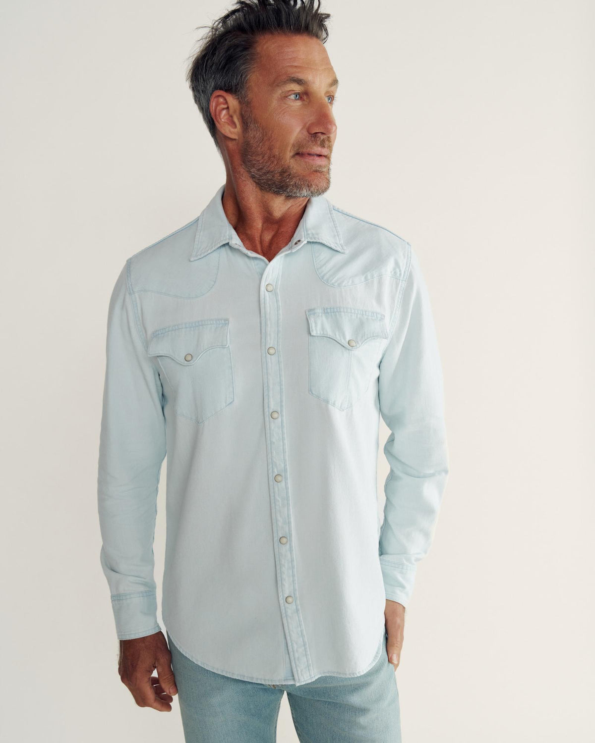 Closeup detail view of Men's Denim Long Sleeve Pearl Snap - Ultra Light