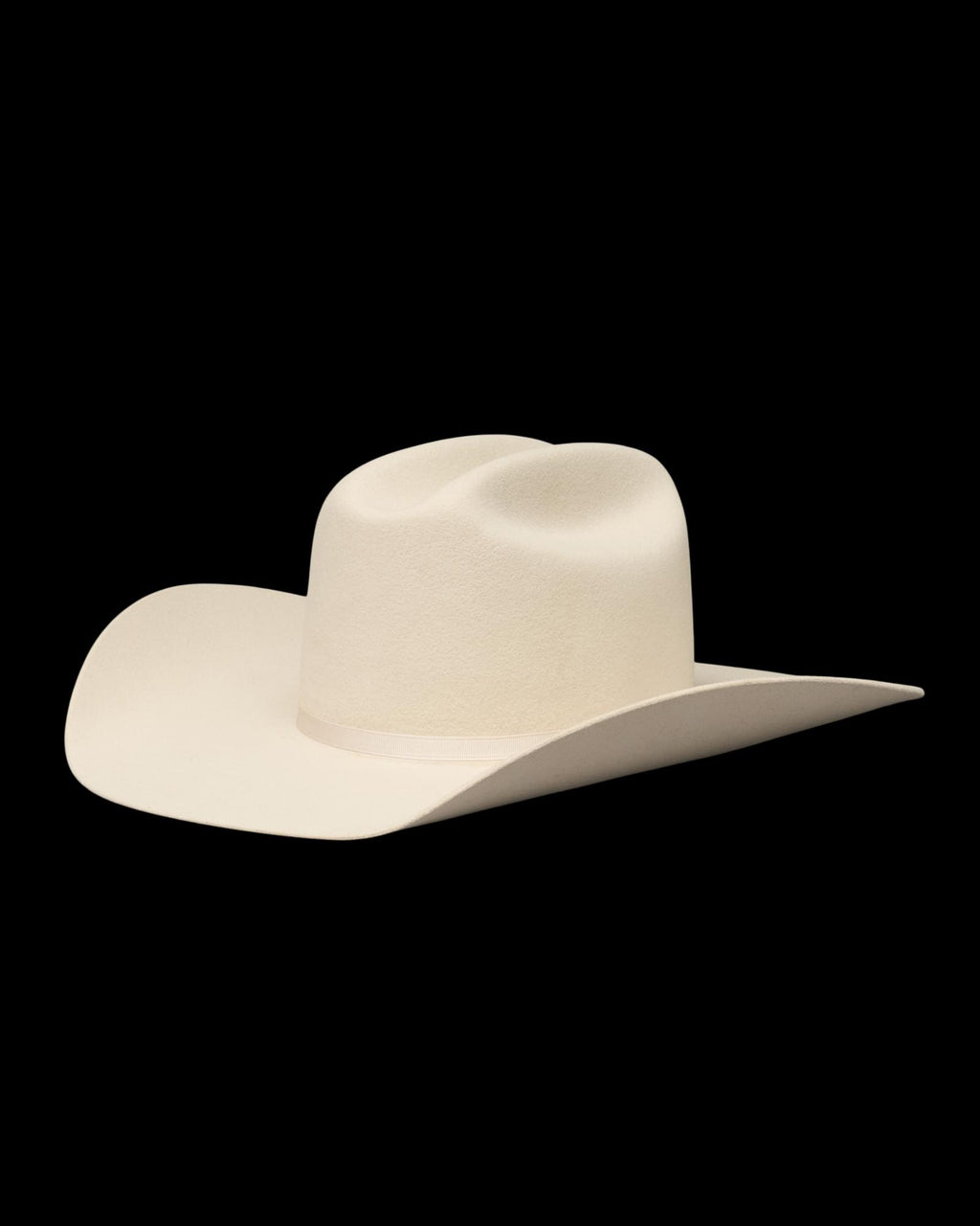 A cream-colored cowboy hat with a wide brim and a creased crown, shown on a white background.