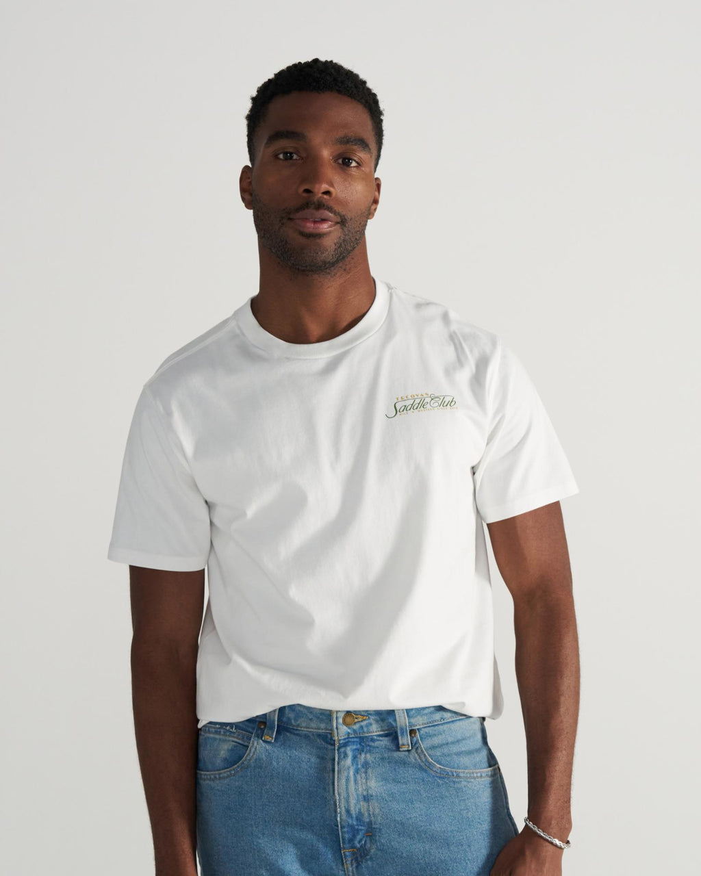 Front view of Men's Saddle Club T-Shirt - Bone/Multi on model