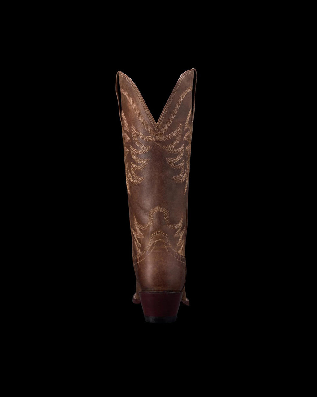 Back view of a brown cowboy boot with decorative stitching on a black background.
