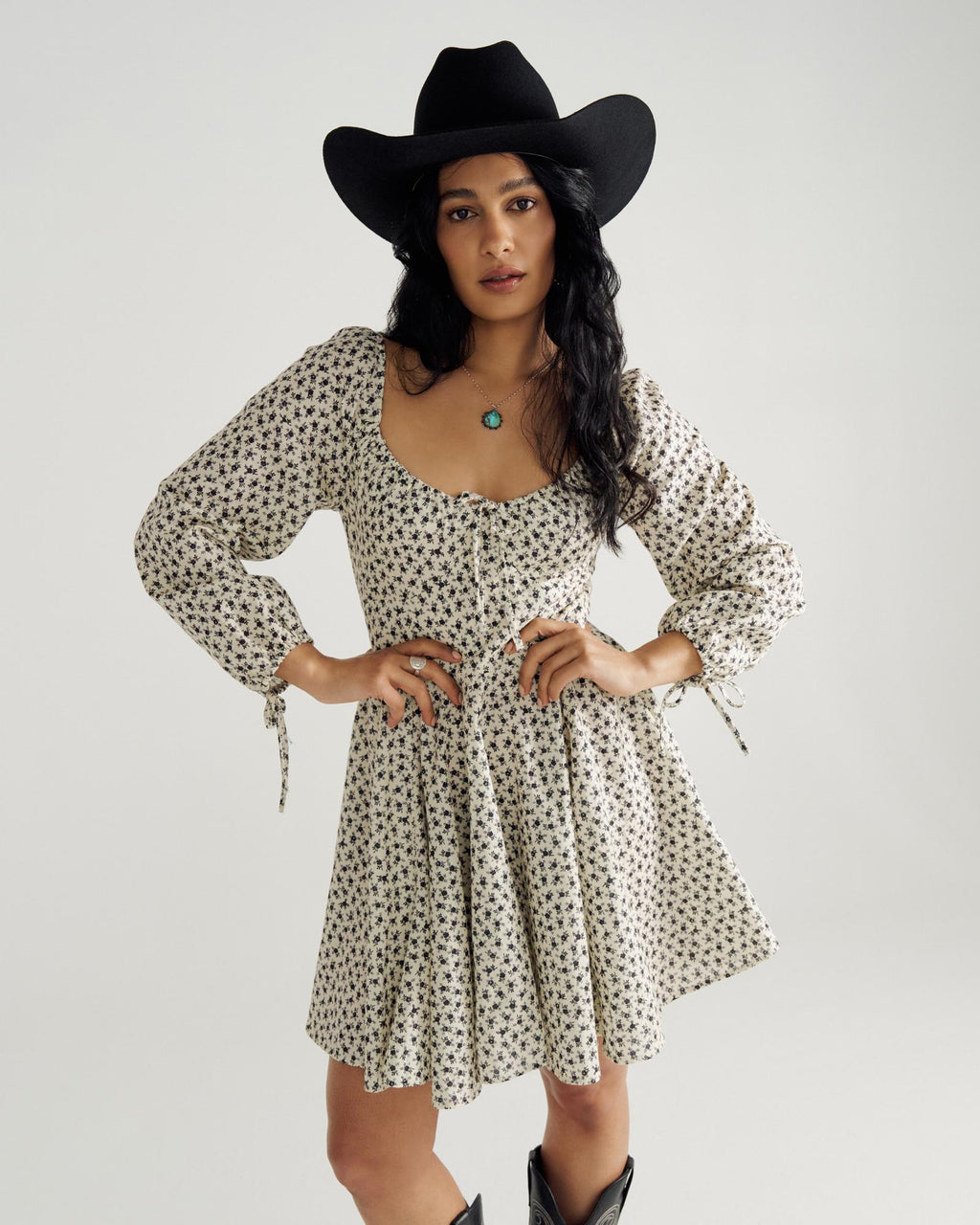 Front view of Women's L/S Mini Dress - Cream / Black on model